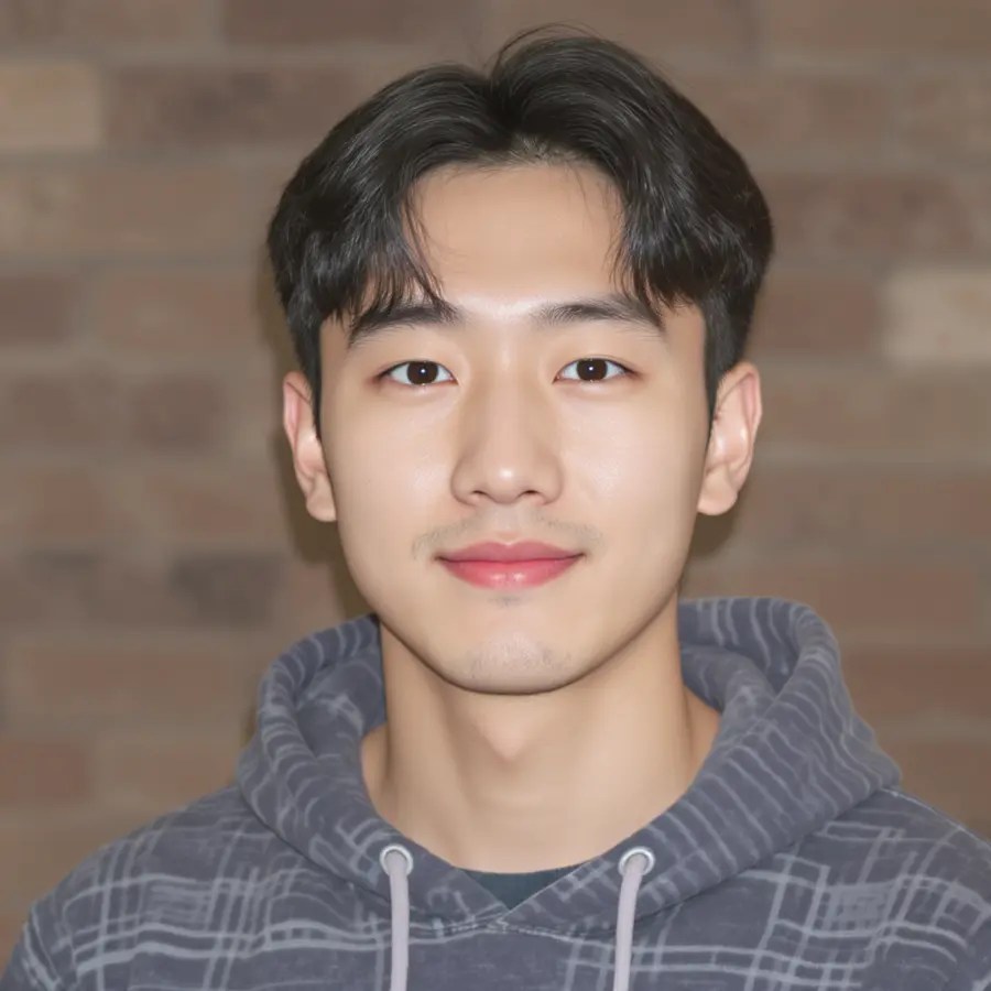 Cinematic profile portrait of a young man in a gray hoodie